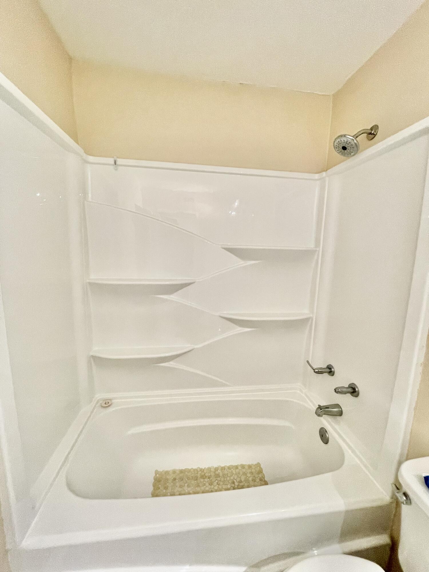 210 Pelham Road, Unit 214A Fort Walton Beach, FL 32547 - Photo 13 of 17 a bathroom with a bathtub