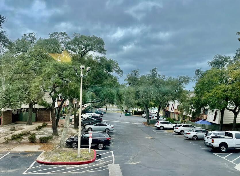 210 Pelham Road, Unit 214A Fort Walton Beach, FL 32547 - Photo 16 of 17 a car parked on the side of the road