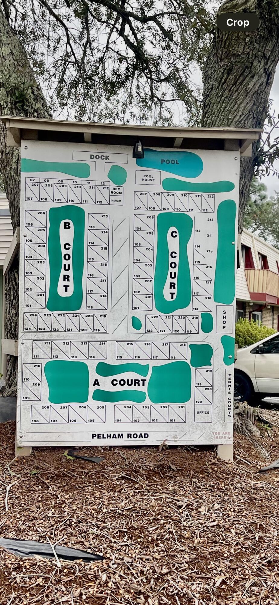 210 Pelham Road, Unit 214A Fort Walton Beach, FL 32547 - Photo 17 of 17 a front view of a house with a garden