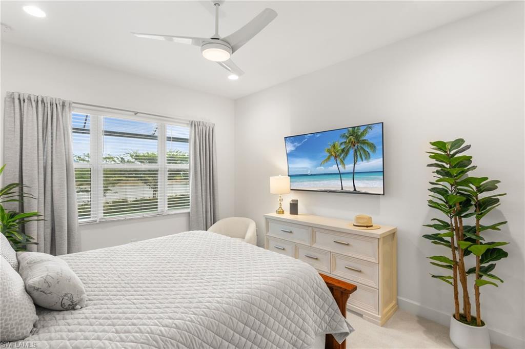 12370 Purple Ficus Way Naples, FL 34120 - Photo 18 of 50 Bedroom with ceiling fan, light carpet, and recessed lighting