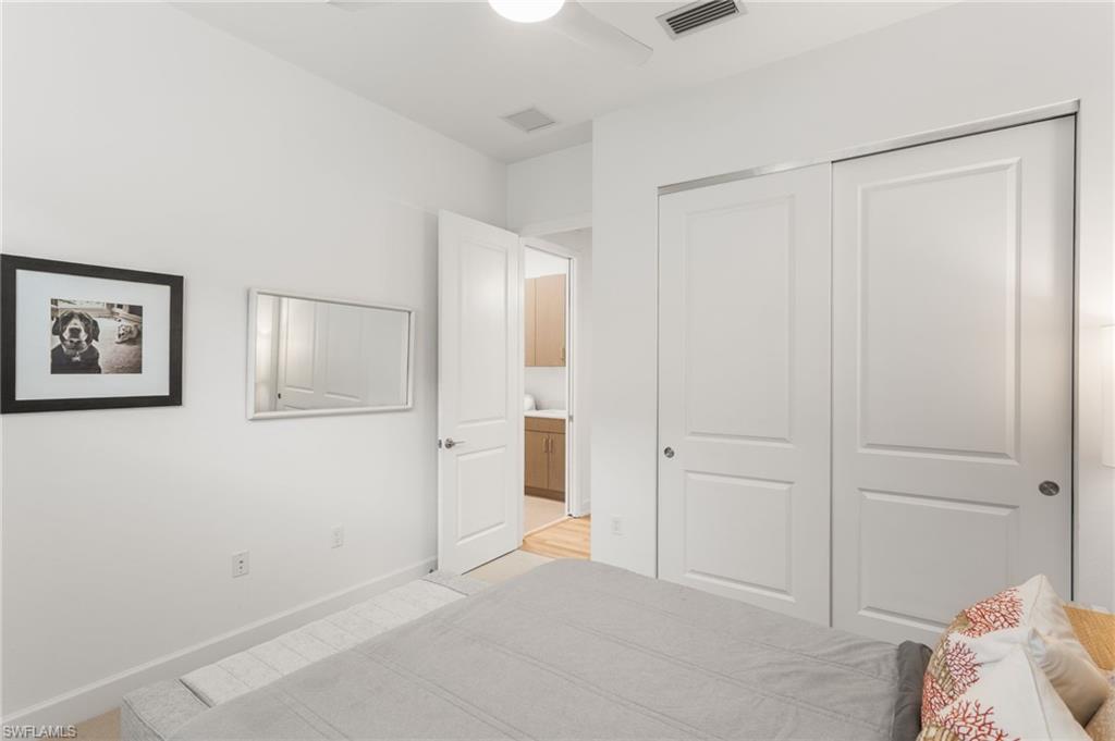 12370 Purple Ficus Way Naples, FL 34120 - Photo 22 of 50 Bedroom featuring a closet and ceiling fan