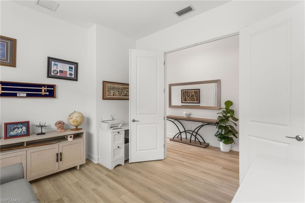 12370 Purple Ficus Way Naples, FL 34120 - Photo 27 of 50 Office featuring light wood-style floors and baseboards