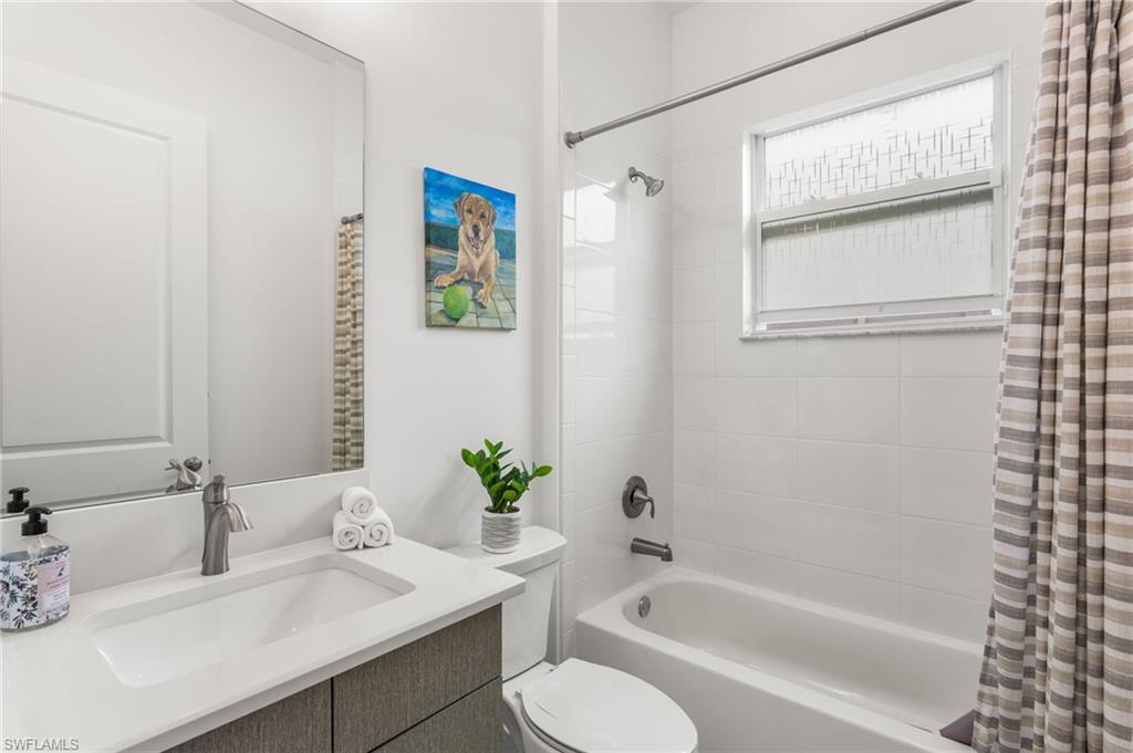 12370 Purple Ficus Way Naples, FL 34120 - Photo 28 of 50 Bathroom with vanity and shower / tub combo