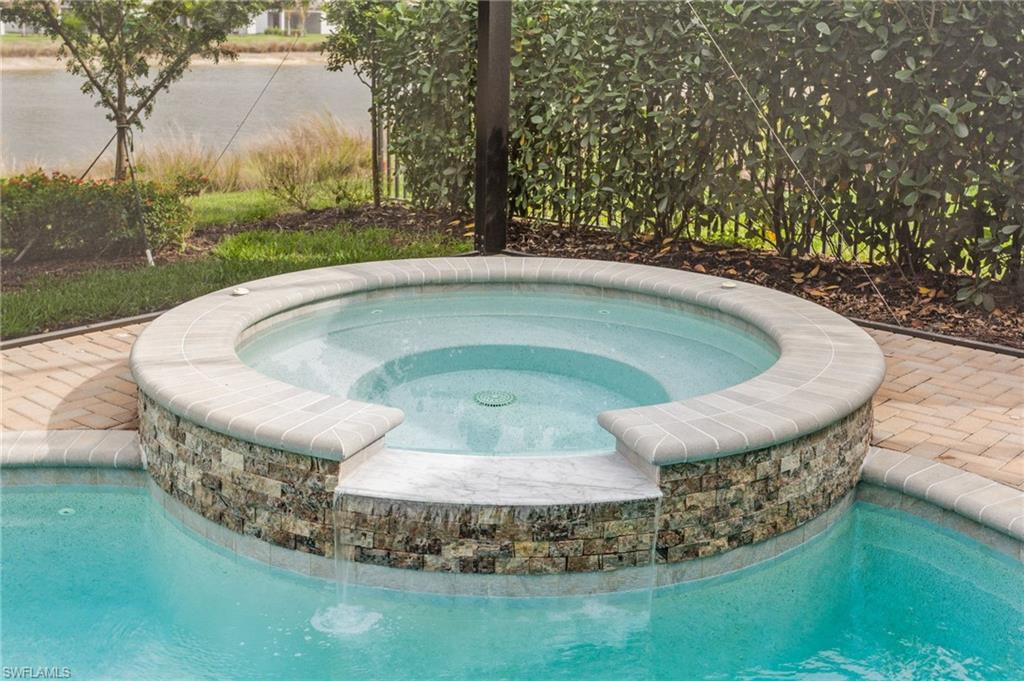 12370 Purple Ficus Way Naples, FL 34120 - Photo 32 of 50 Integrated pool / hot tub with a patio area