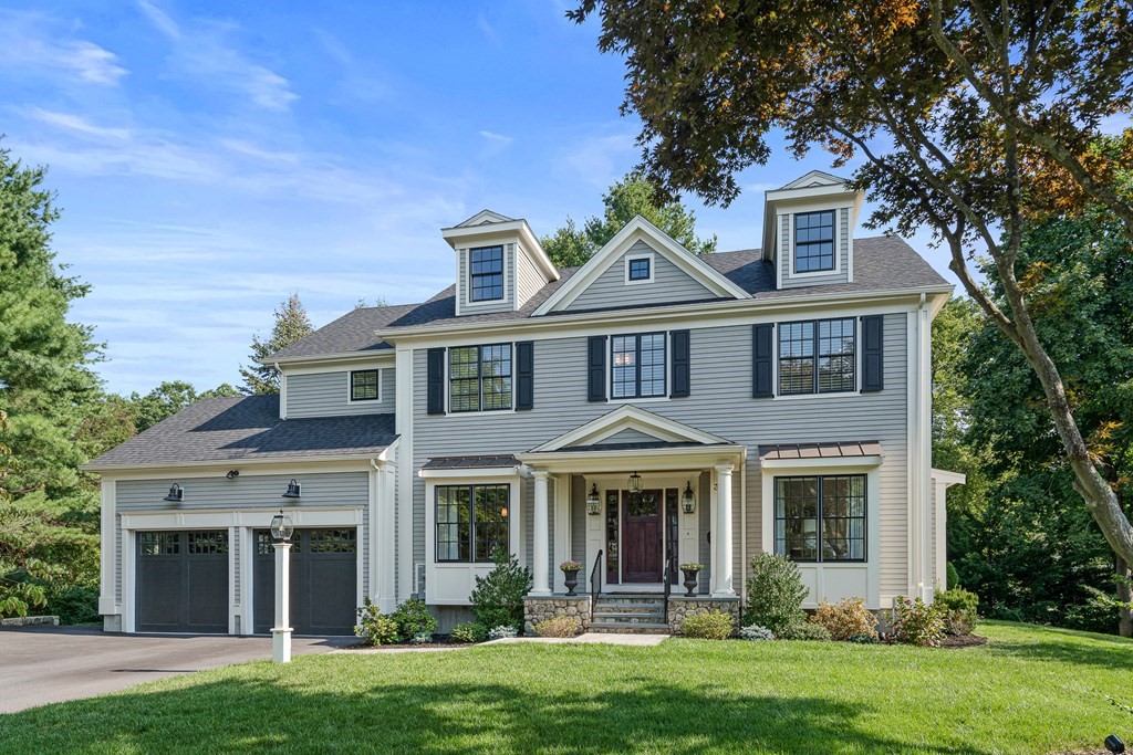 front view of a house with a yard