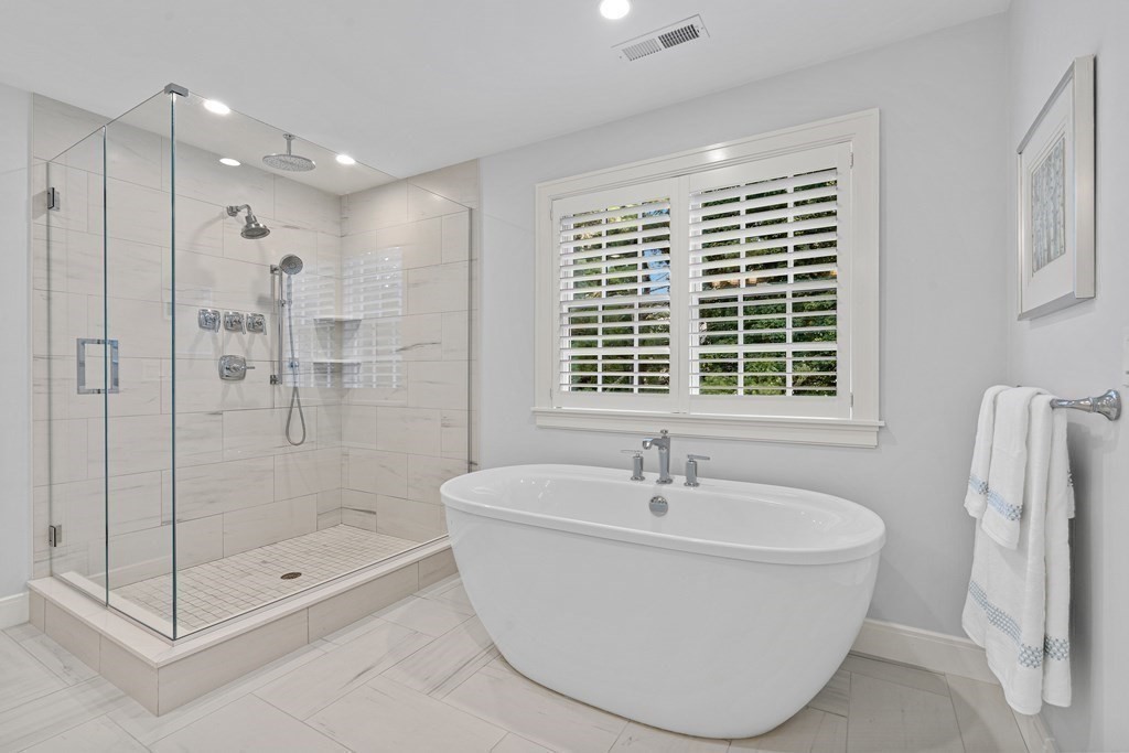 34 Willow Road Wellesley, MA 02482 - Photo 15 of 26 a bathroom with a bathtub and shower
