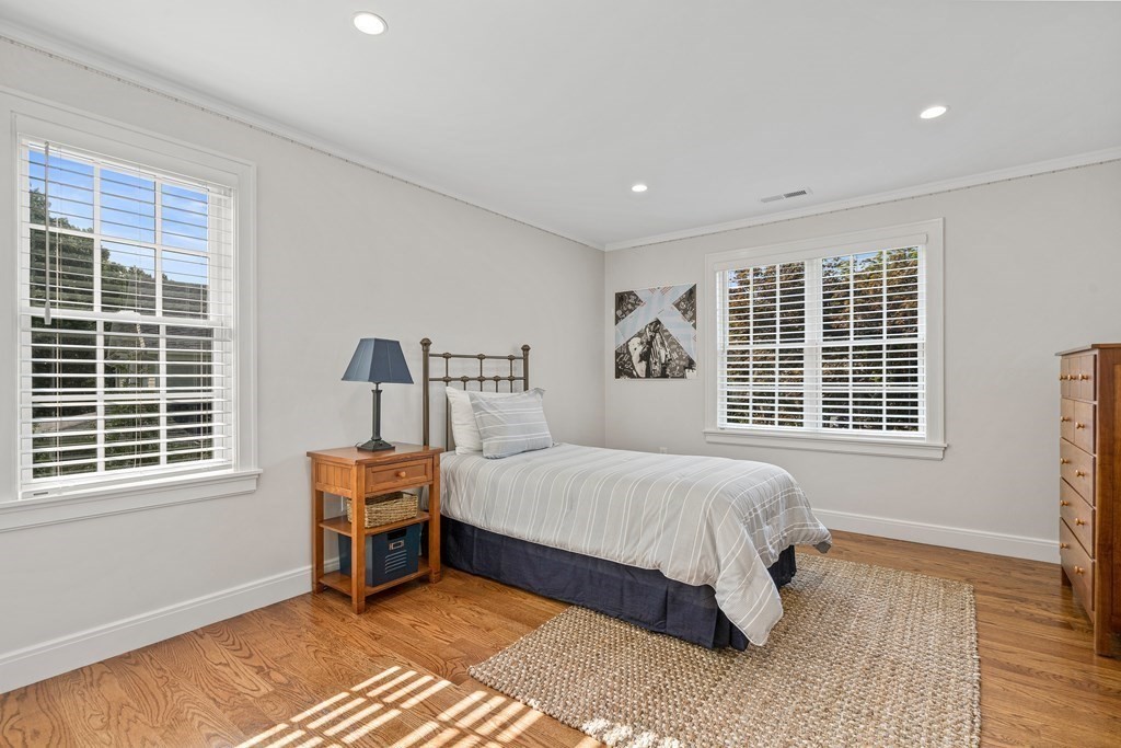 34 Willow Road Wellesley, MA 02482 - Photo 20 of 26 a bedroom with a bed and a window