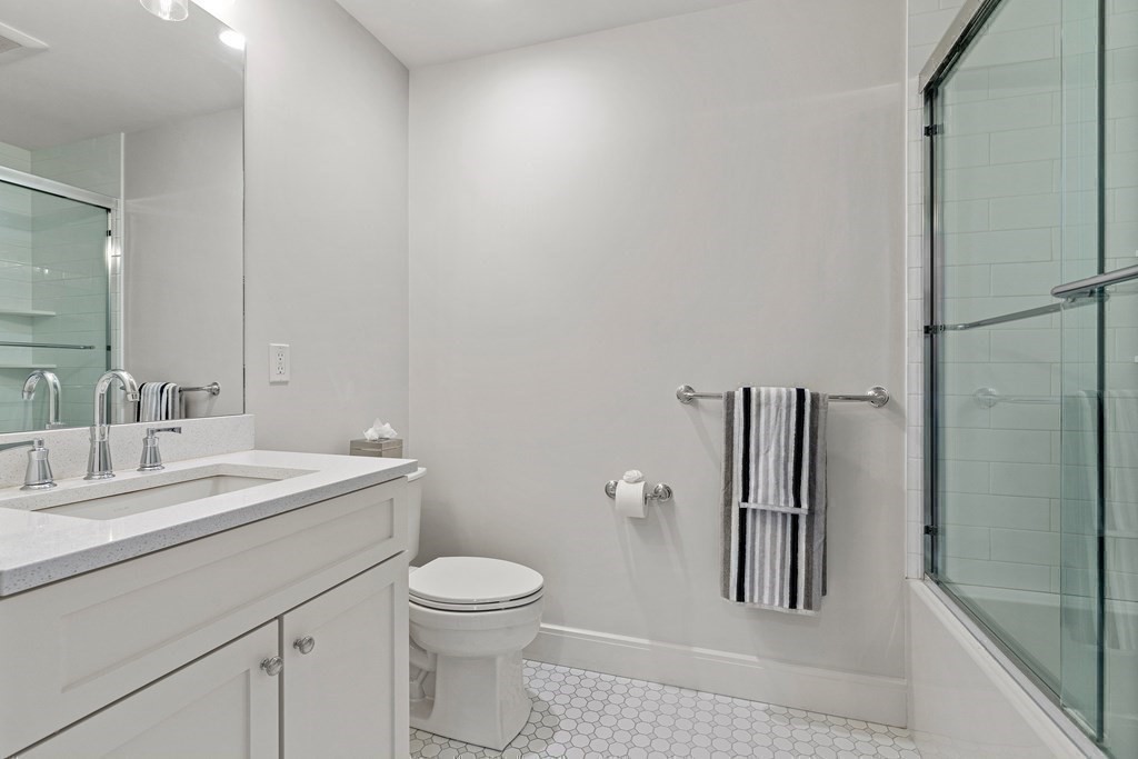 34 Willow Road Wellesley, MA 02482 - Photo 21 of 26 a bathroom with a sink a toilet and shower