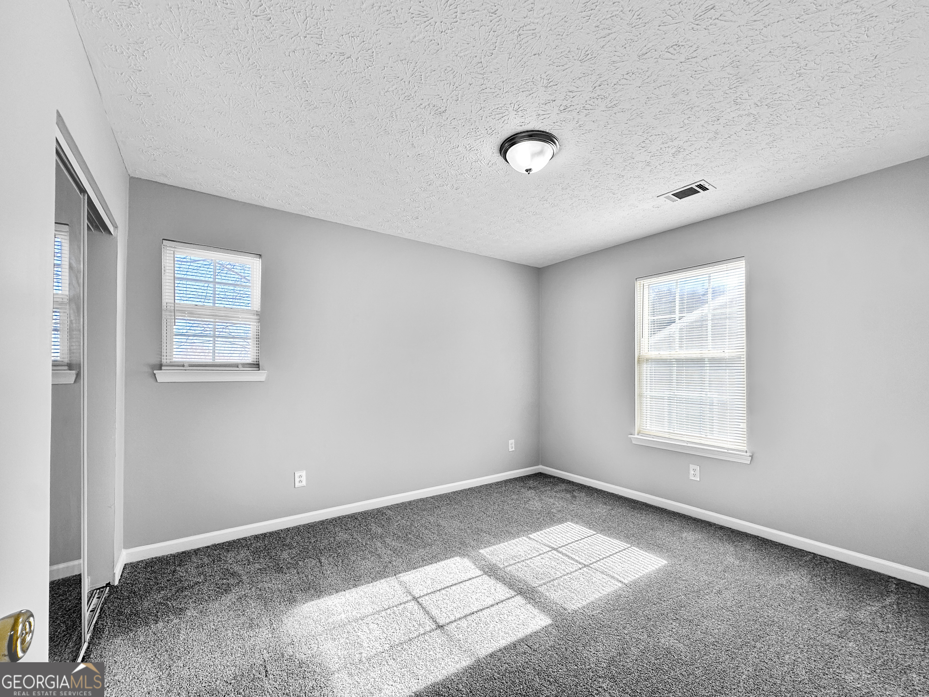 4045 Springvale Way McDonough, GA 30252 - Photo 13 of 18 a view of an empty room with a window