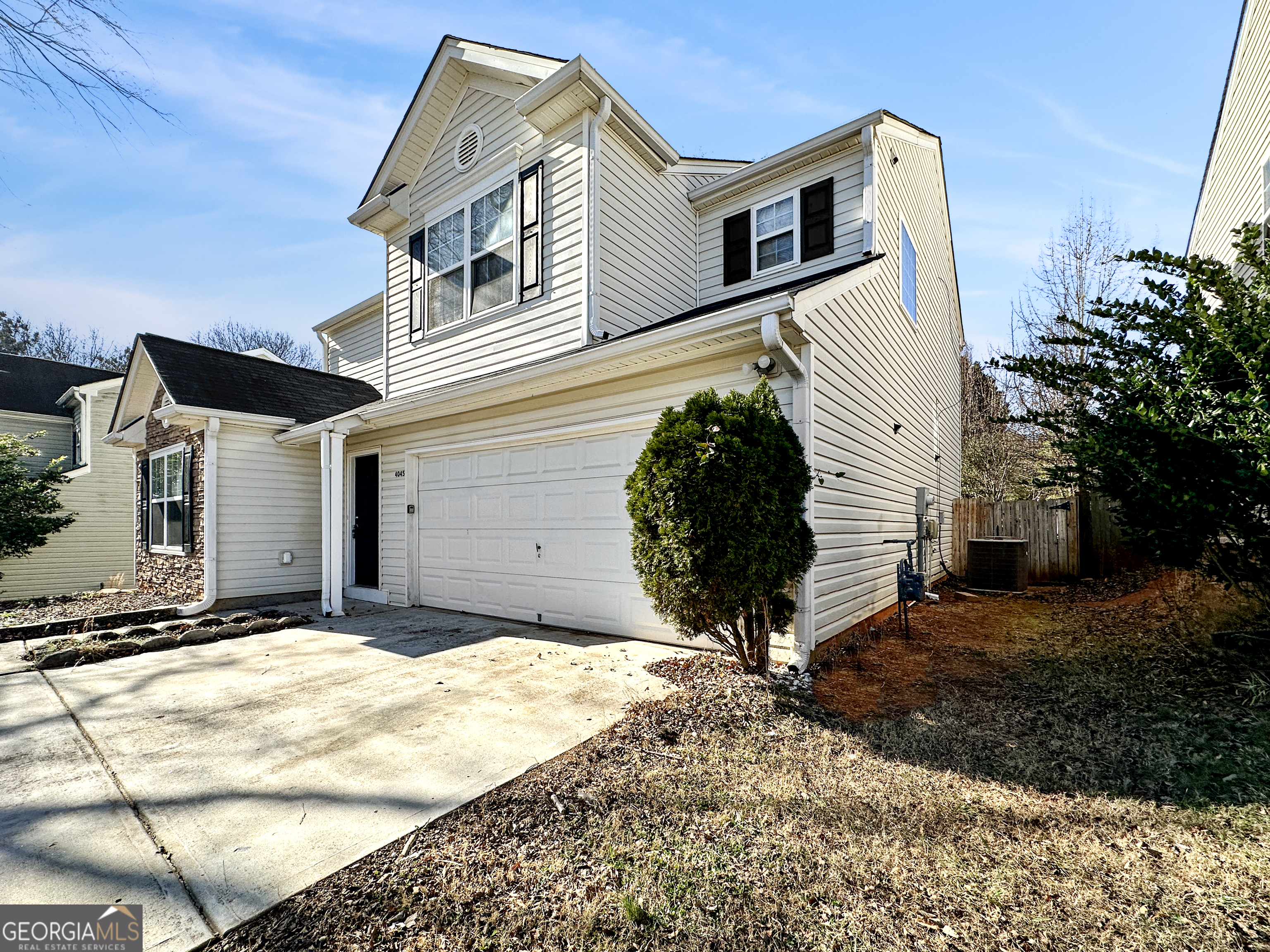 4045 Springvale Way McDonough, GA 30252 - Photo 3 of 18 a front view of a house with a yard
