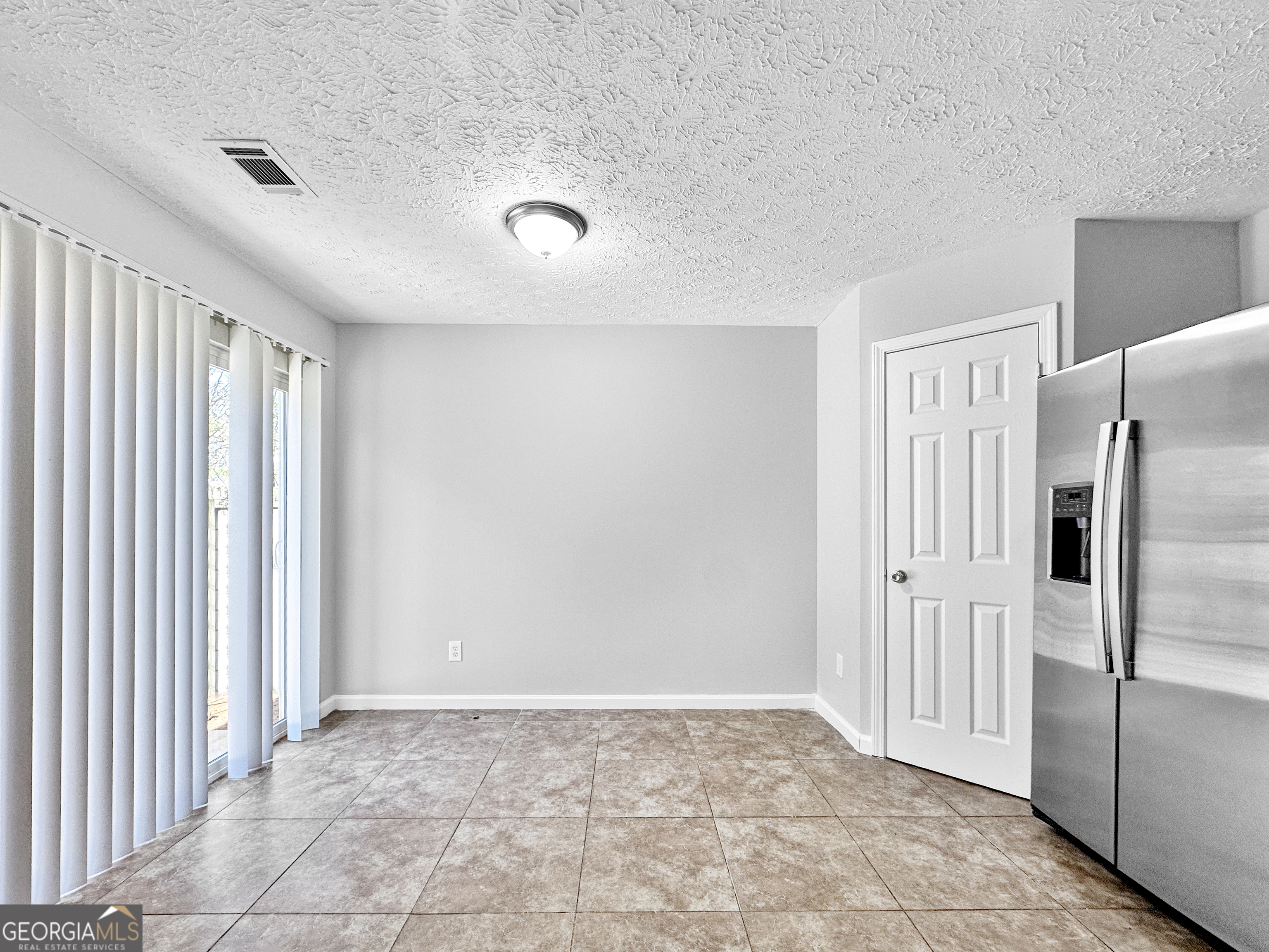 4045 Springvale Way McDonough, GA 30252 - Photo 7 of 18 a view of a livingroom with an empty space
