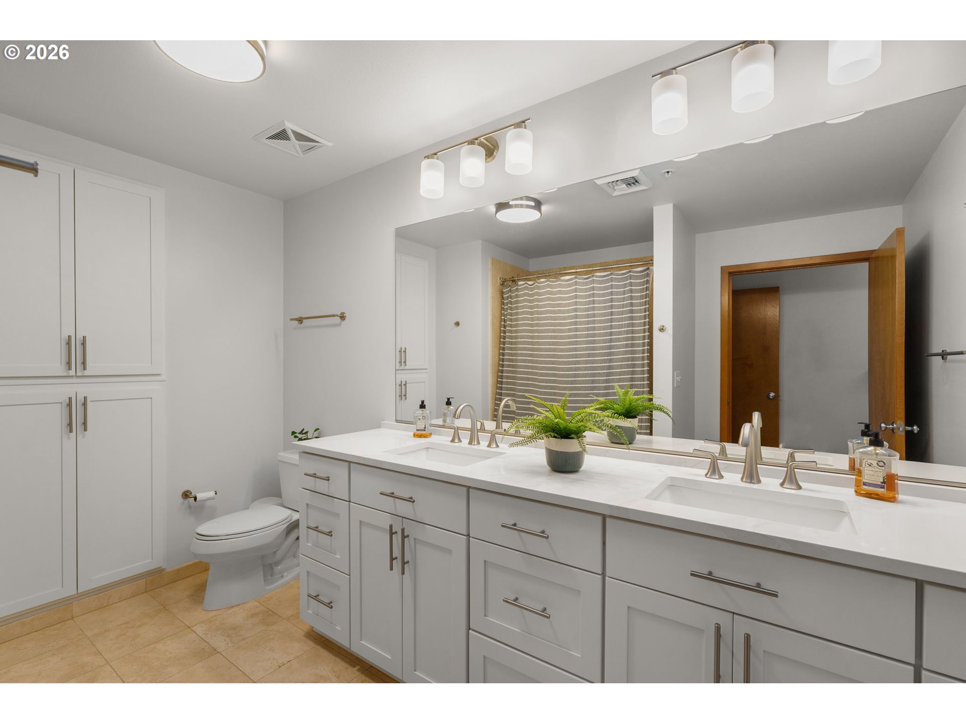 2350 Northwest Savier Street, Unit 224 Portland, OR 97210 - Photo 13 of 19 a bathroom with a double vanity sink toilet and a mirror