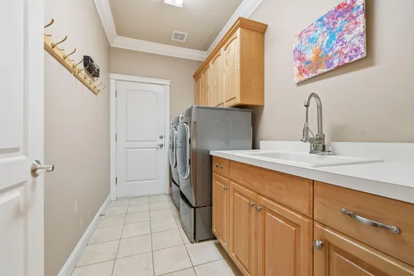 a hallway with washer and dryer