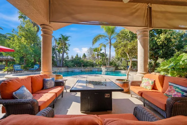a outdoor living space with patio furniture and a garden