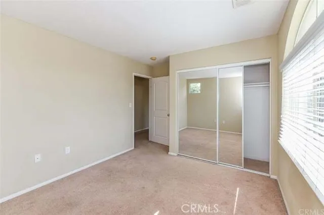 an empty room with sliding door