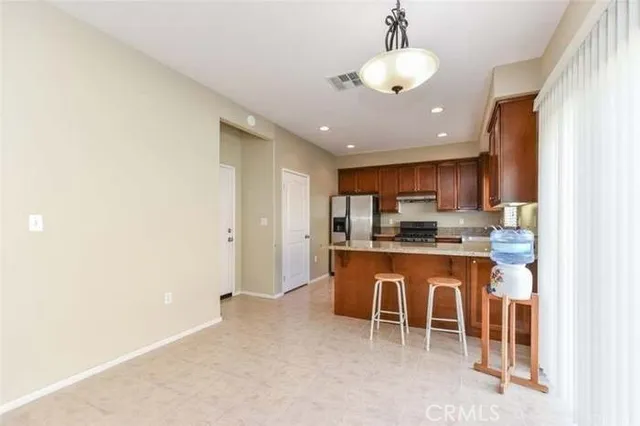 a kitchen with stainless steel appliances granite countertop a sink and cabinets