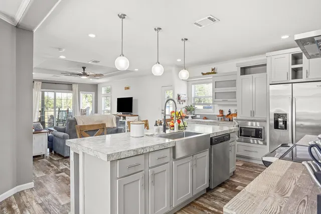a kitchen with counter top space appliances and cabinets