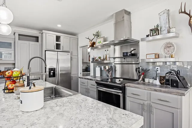 a kitchen with a refrigerator and a sink