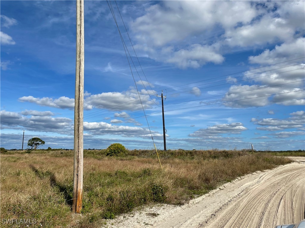 6980 6th Road LaBelle, FL 33935 - Photo 5 of 8 a view of a road from a yard