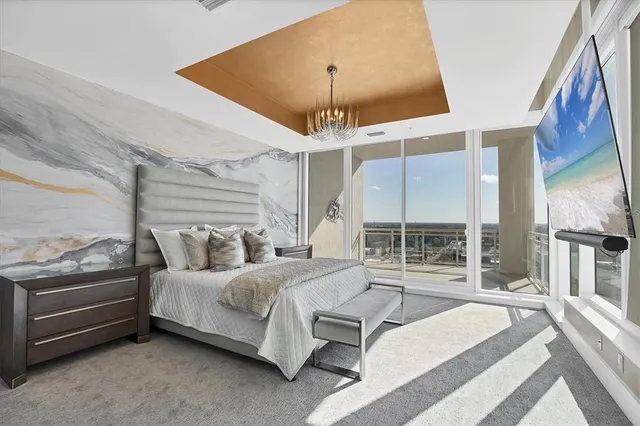 a room with gym equipment pool table and windows