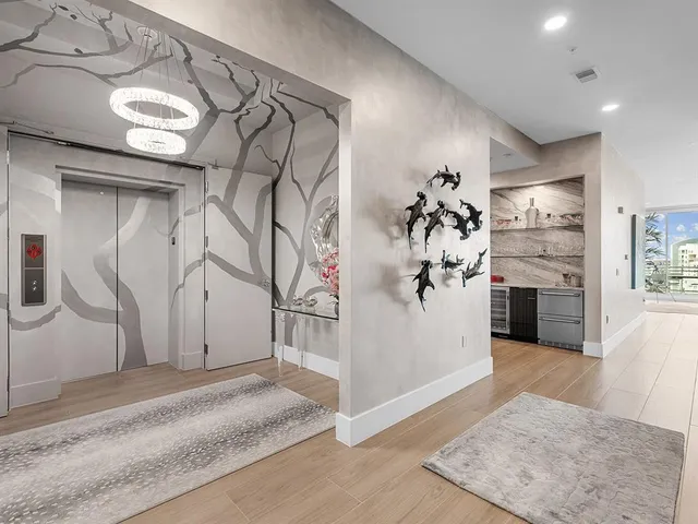 a bathroom with a granite countertop toilet sink and mirror