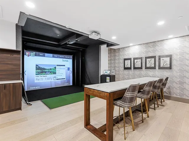 an aerial view of a house with a swimming pool patio and outdoor seating