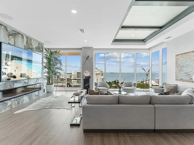 a bathroom with a granite countertop sink a mirror and shower