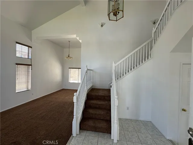 a view of entryway and hall with a front door