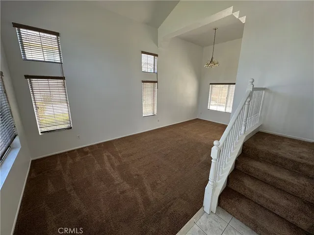 a view of an empty room with windows