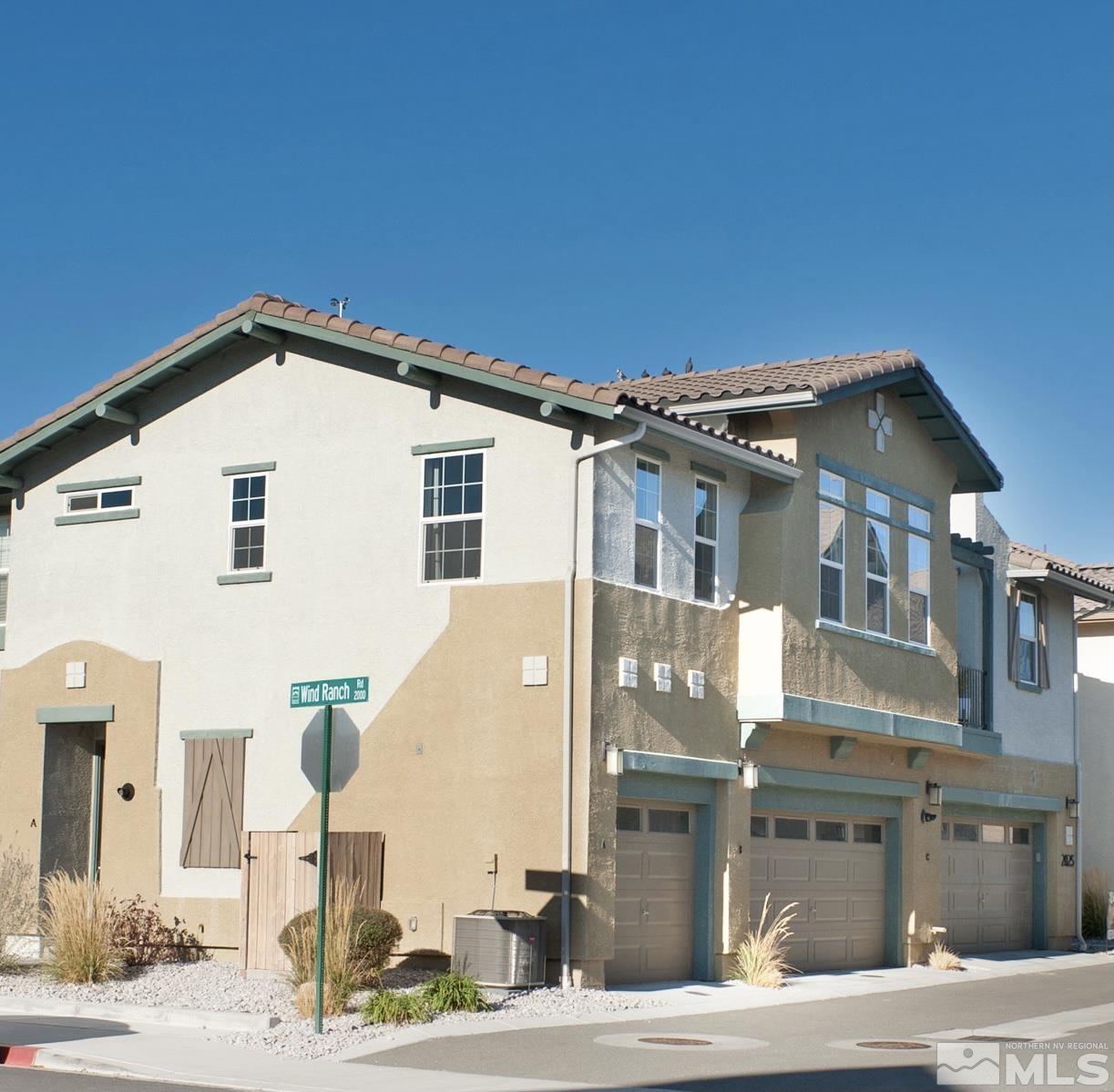 2025 Wind Ranch Road, Unit C Reno, NV 89521 - Photo 1 of 31 a front view of a house with a yard