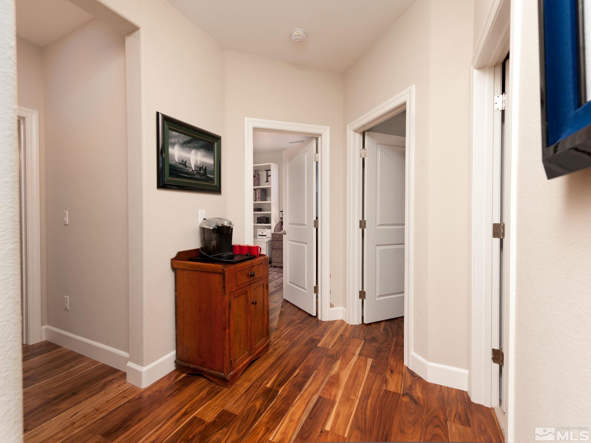 2025 Wind Ranch Road, Unit C Reno, NV 89521 - Photo 22 of 31 a room with wooden floor and a window