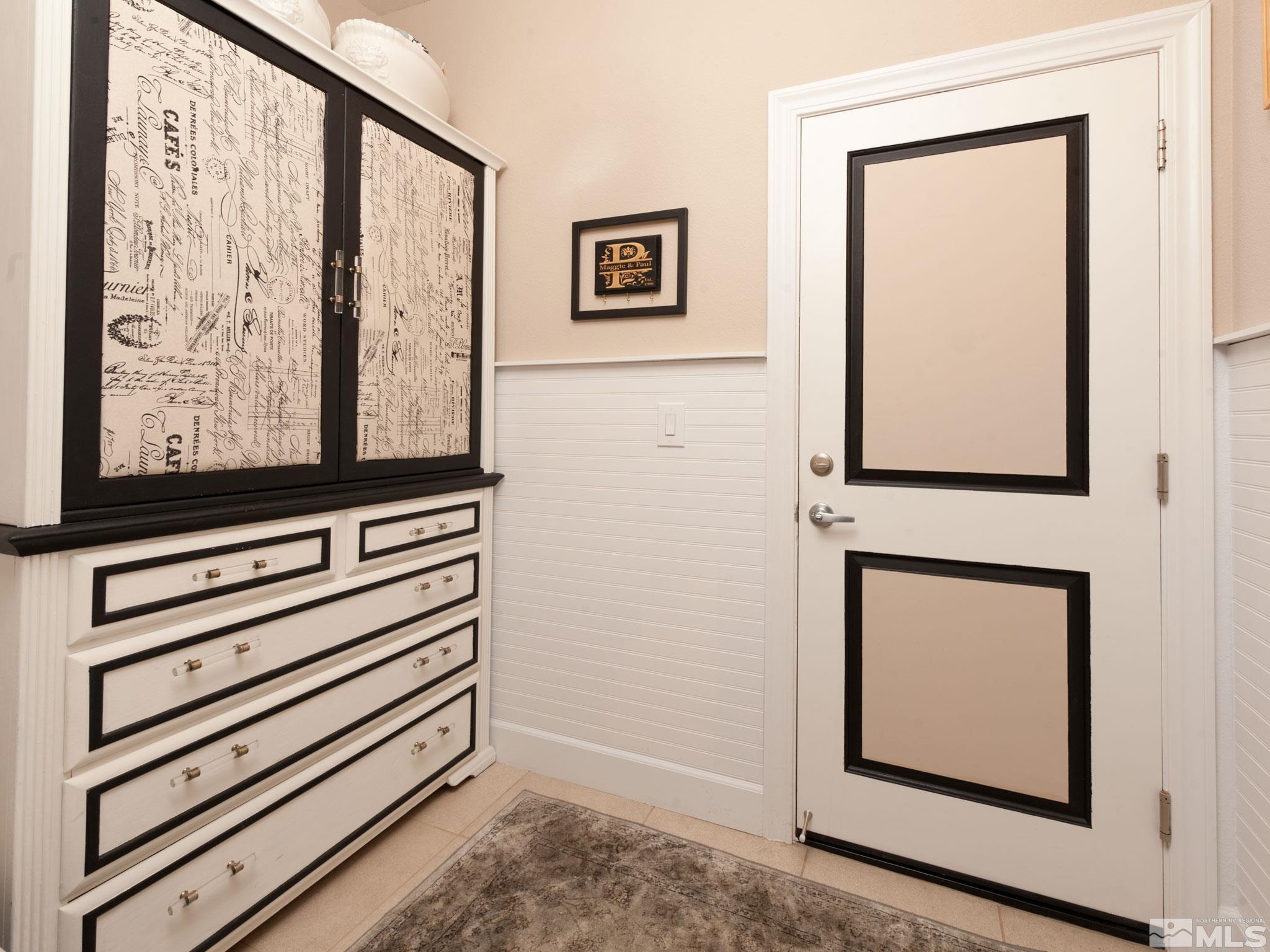 2025 Wind Ranch Road, Unit C Reno, NV 89521 - Photo 24 of 31 a view of a hallway with paintings on the wall