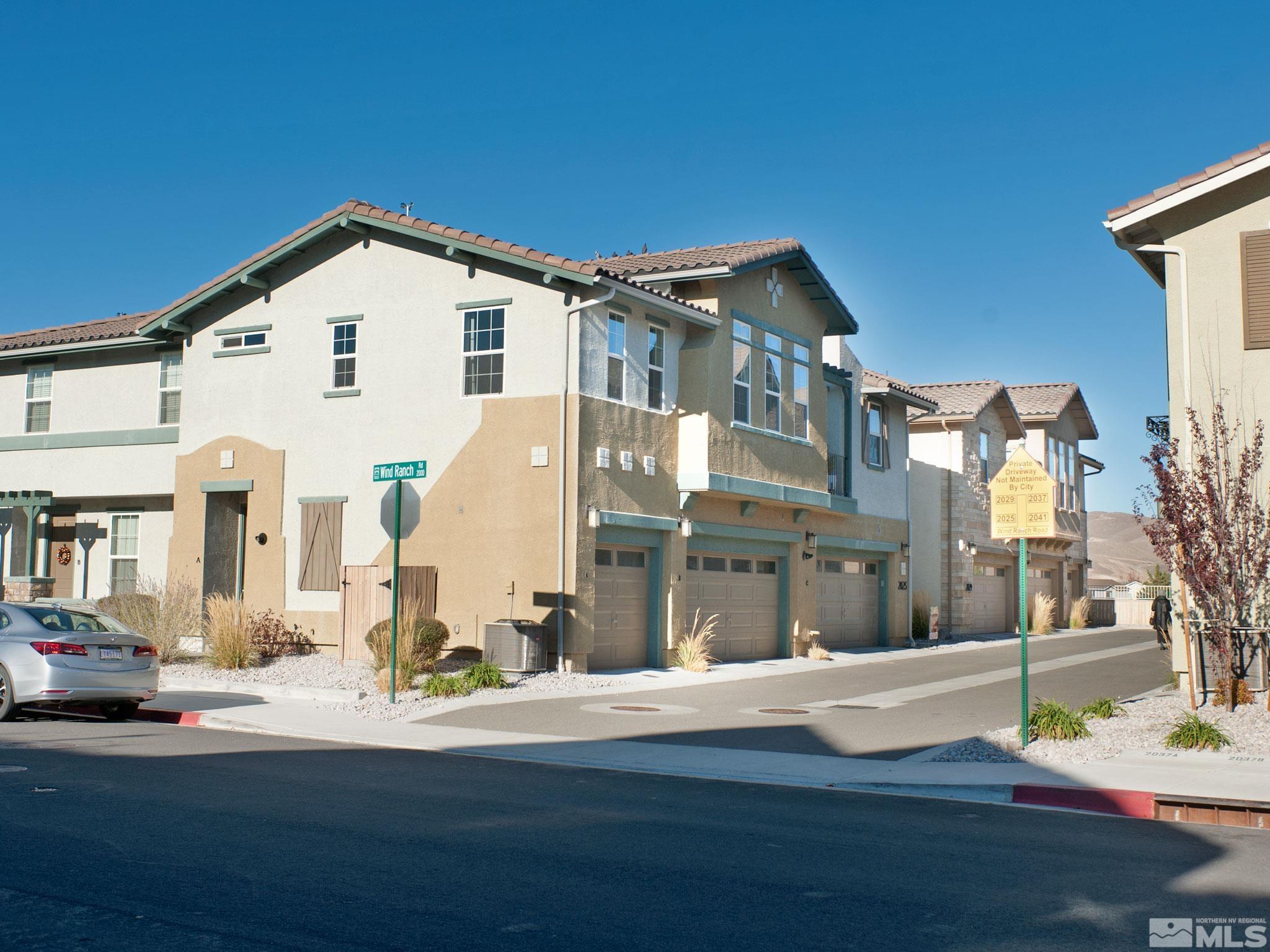 2025 Wind Ranch Road, Unit C Reno, NV 89521 - Photo 27 of 31 a view of residential houses with yard and road