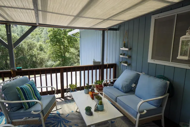 a view of a deck with furniture