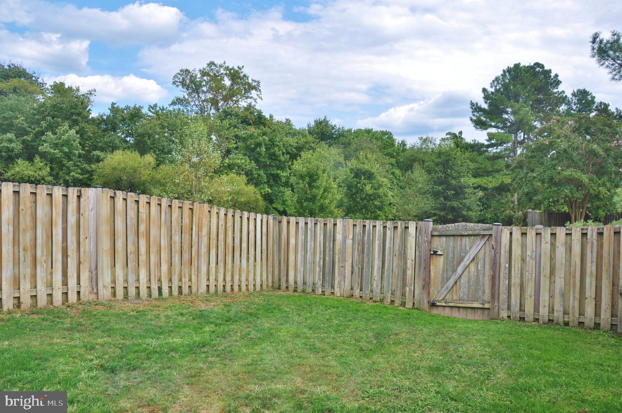 21 Margery Court Nottingham, MD 21236 - Photo 11 of 67 a view of a backyard with wooden fence