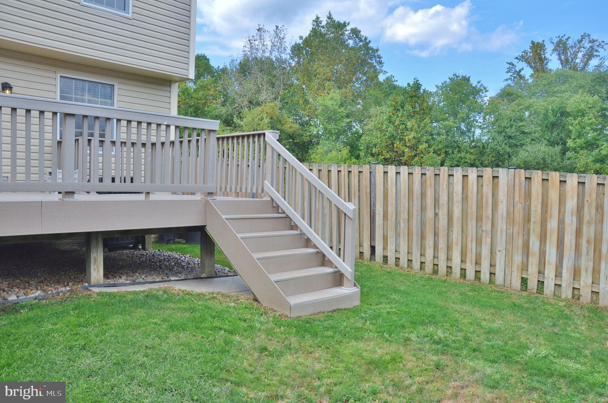 21 Margery Court Nottingham, MD 21236 - Photo 12 of 67 a view of a deck with a bench and a yard