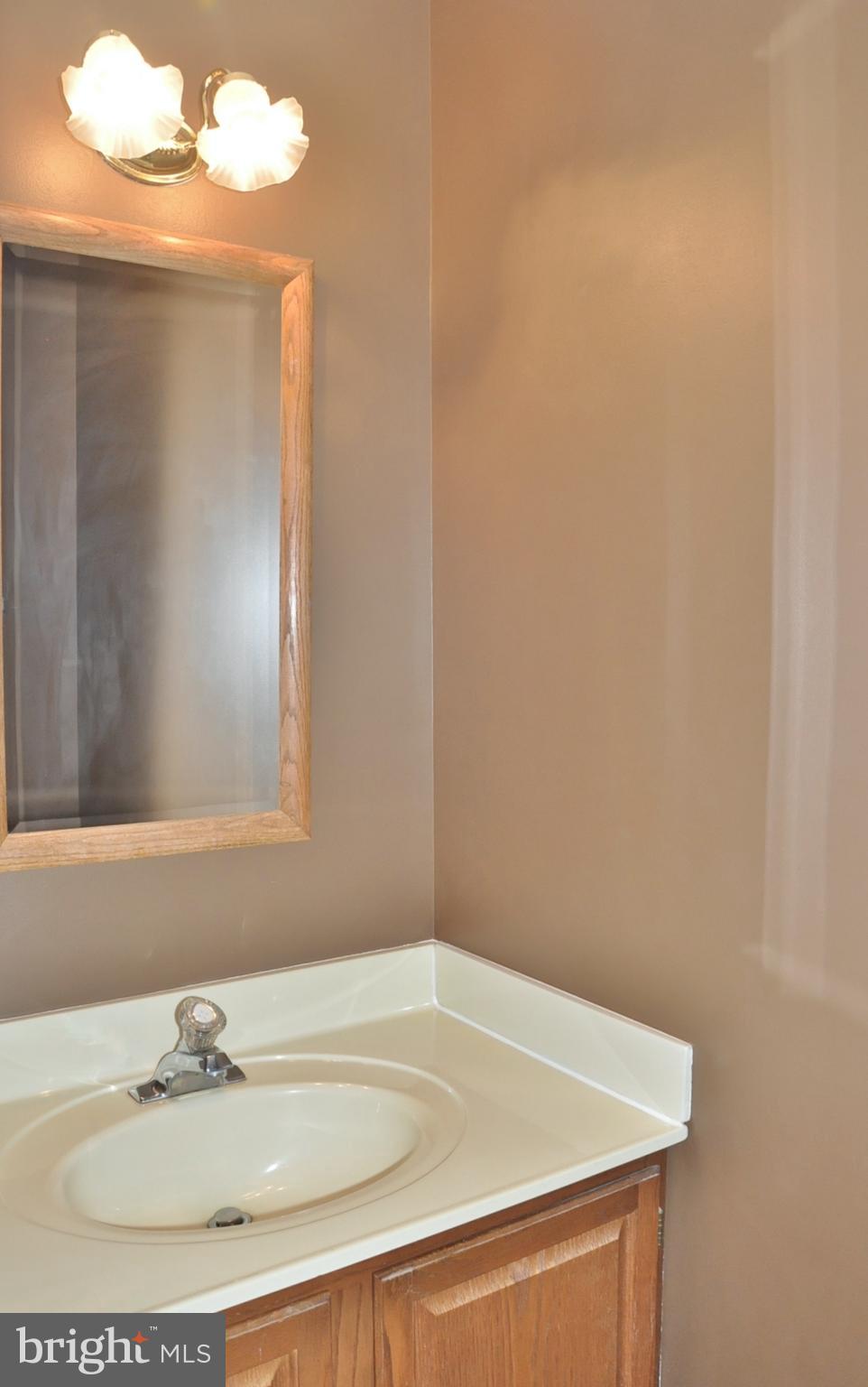 21 Margery Court Nottingham, MD 21236 - Photo 22 of 67 a bathroom with a sink and a mirror