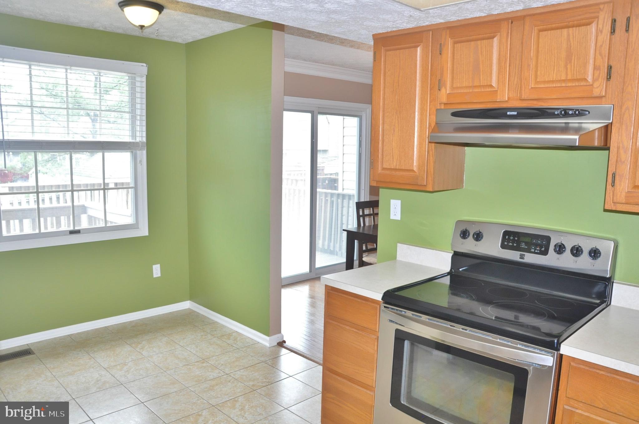 21 Margery Court Nottingham, MD 21236 - Photo 26 of 67 a kitchen with a stove and a microwave
