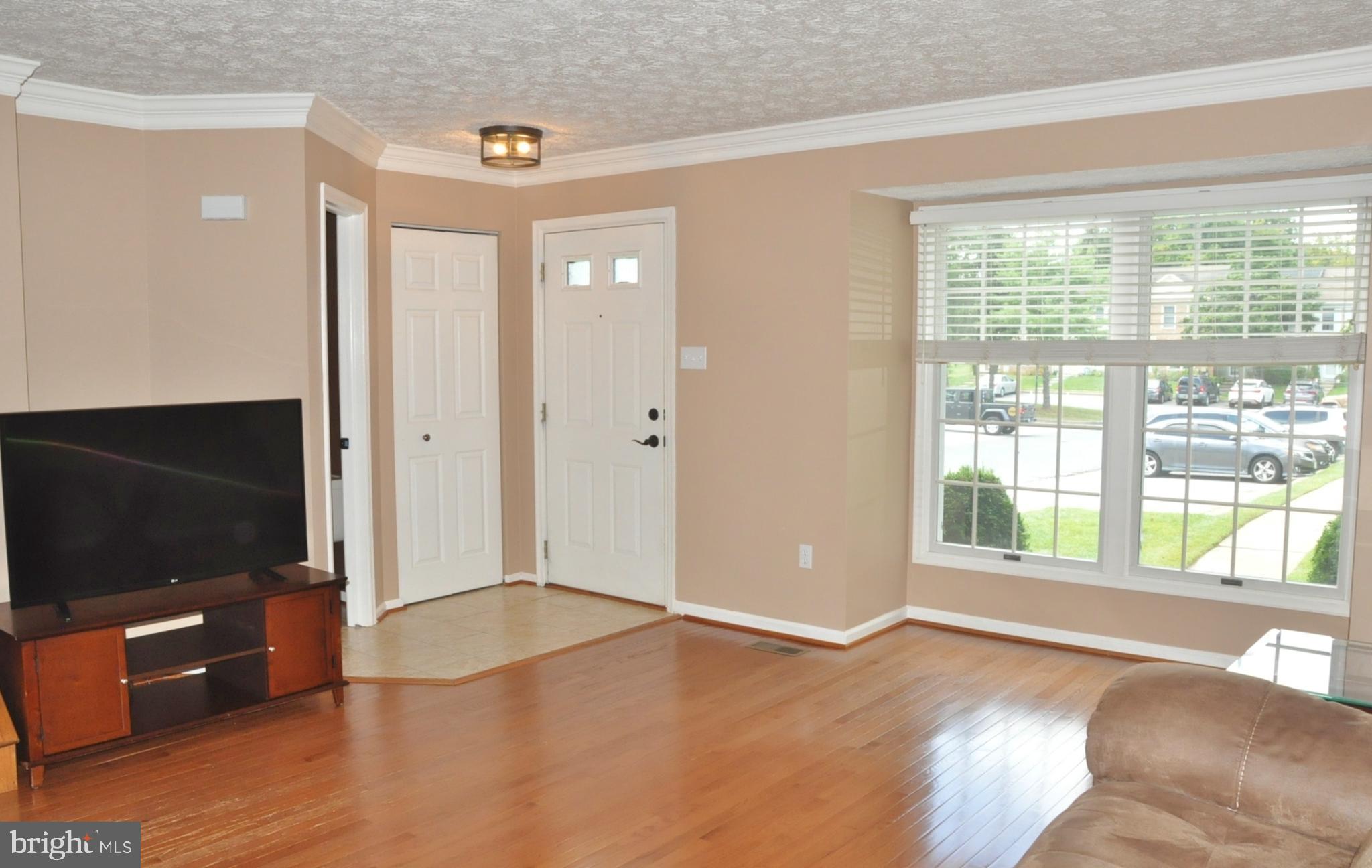 21 Margery Court Nottingham, MD 21236 - Photo 3 of 67 a view of an empty room with glass door and windows