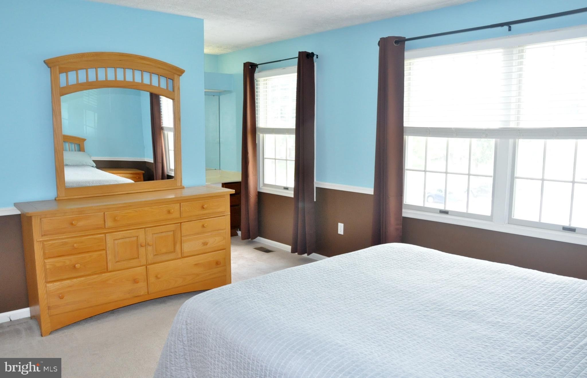 21 Margery Court Nottingham, MD 21236 - Photo 34 of 67 a bedroom with a bed and a dresser