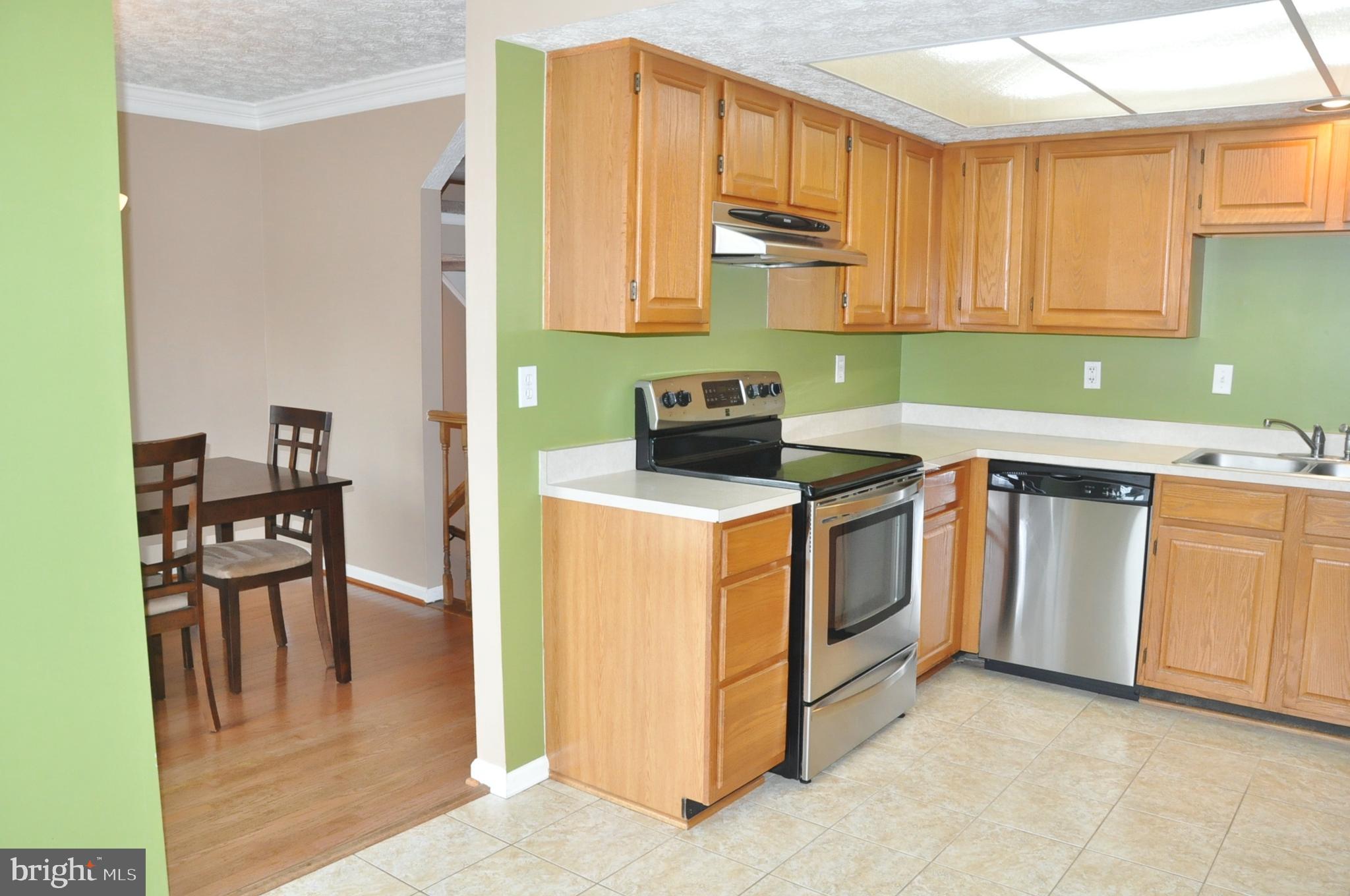 21 Margery Court Nottingham, MD 21236 - Photo 4 of 67 a kitchen with a stove sink and cabinets
