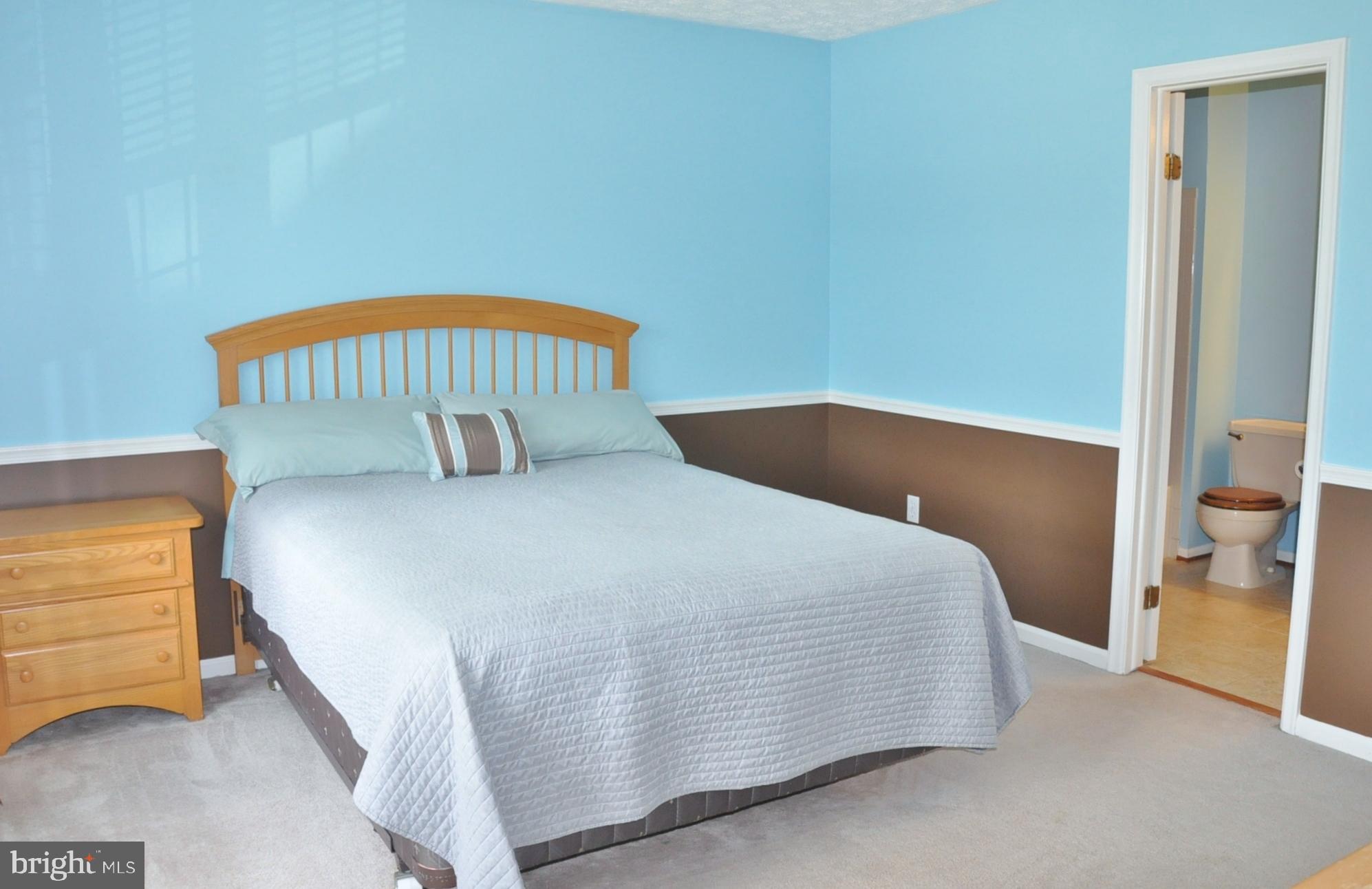 21 Margery Court Nottingham, MD 21236 - Photo 5 of 67 a bedroom with a bed and a lamp