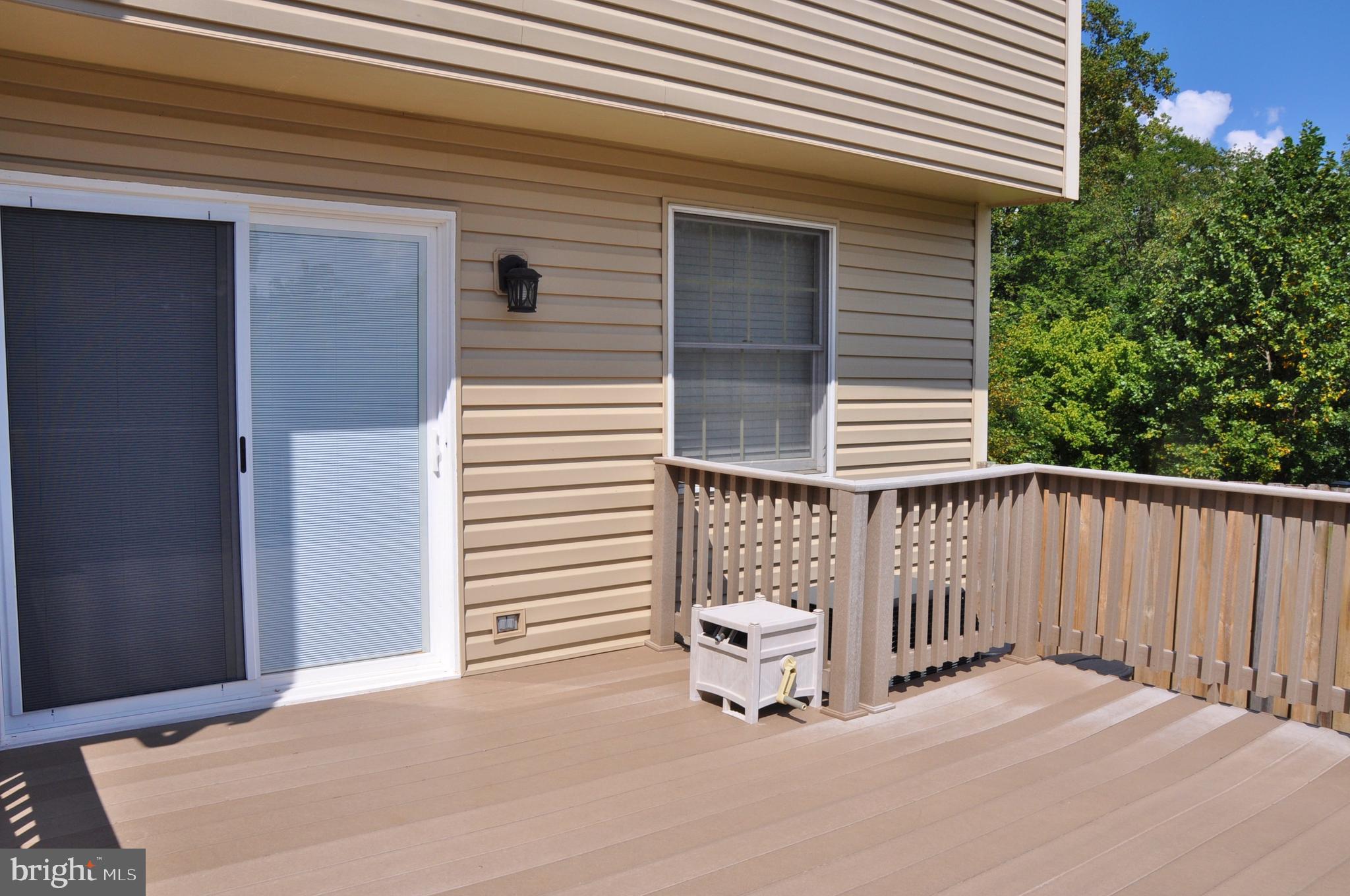 21 Margery Court Nottingham, MD 21236 - Photo 10 of 67 a view of a balcony with a door and wooden floor