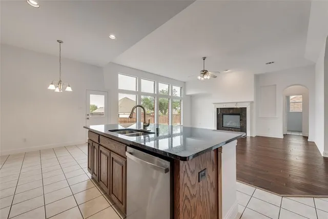 a kitchen with sink cabinets and window