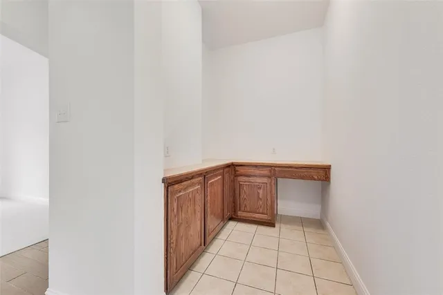 a hallway view with hardwood
