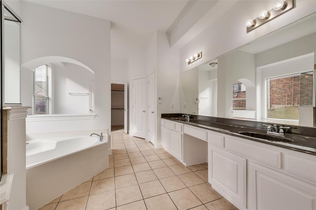 413 Kearsarge Street DeSoto, TX 75115 - Photo 21 of 33 a large white kitchen with a sink and cabinets
