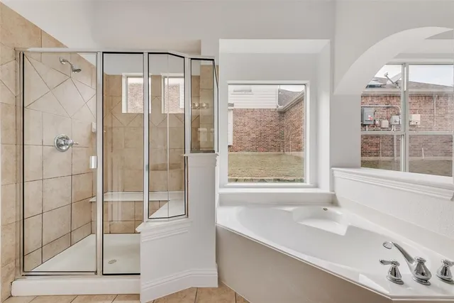 a bathroom with a bathtub and a sink