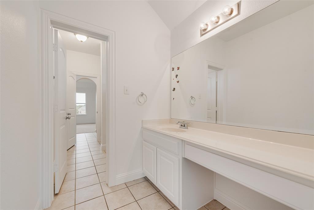 413 Kearsarge Street DeSoto, TX 75115 - Photo 25 of 33 a bathroom with a sink a toilet and a mirror