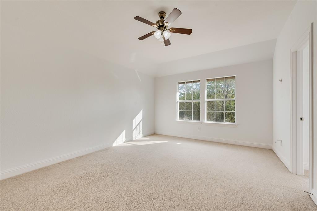 413 Kearsarge Street DeSoto, TX 75115 - Photo 26 of 33 an empty room with a window and a fan