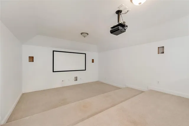 a view of an empty room with windows